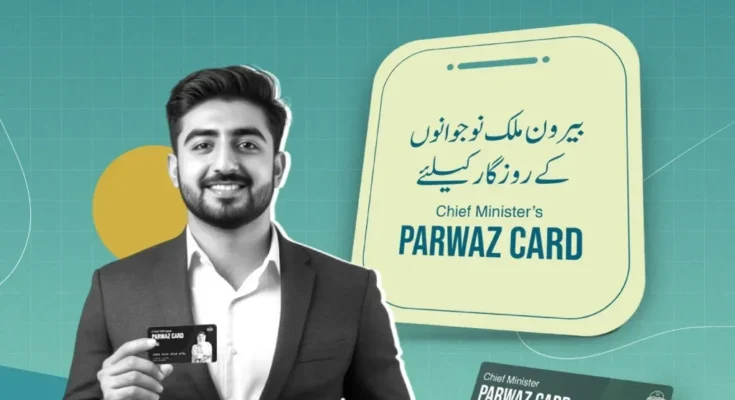 Pakistani young man holding the Chief Minister’s Parwaz Card for overseas employment under Punjab government initiative.
